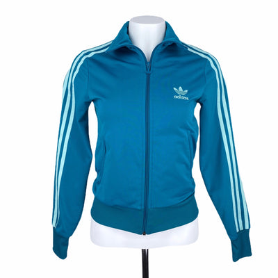 Adidas 16.5&quot; Chest
22&quot; Length
25$ to 50$
Activewear
Adidas
Coats &amp; Jackets
Excellent Condition
Size Small
Teal
Track Jacket
W0045-1700
Women